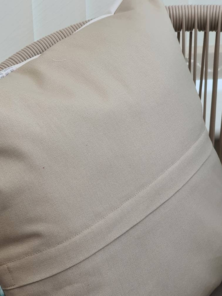 This photo shows the enclosed zip half way down the reverse of the cushion cover.