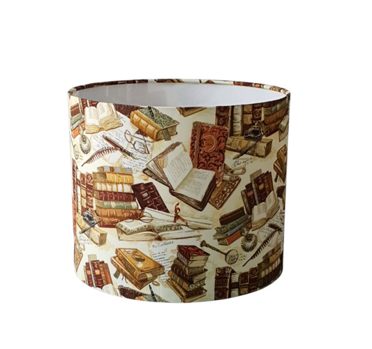 Library Books drum lampshade angled view of vintage books on sepia fabric.
