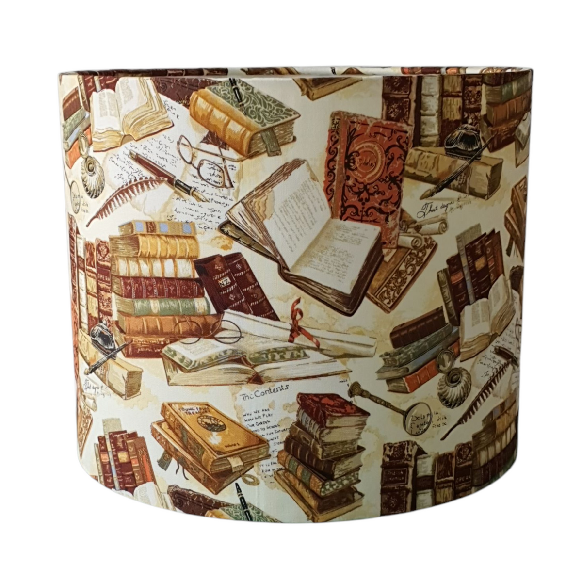 Library Books drum lampshade close view of stacked books and open pages.
