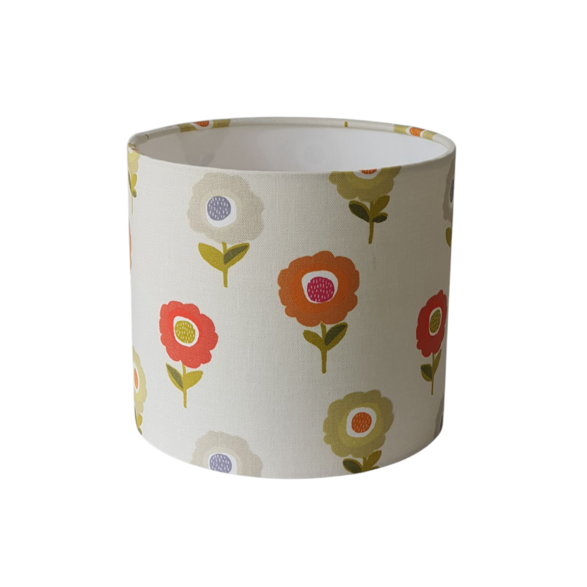 Handmade 20cm drum lampshade made with Fryetts Elsa Tutti Frutti fabric.  The pattern on the fabric is of colourful retro style flowers and would brighten and refresh any style of home decor.