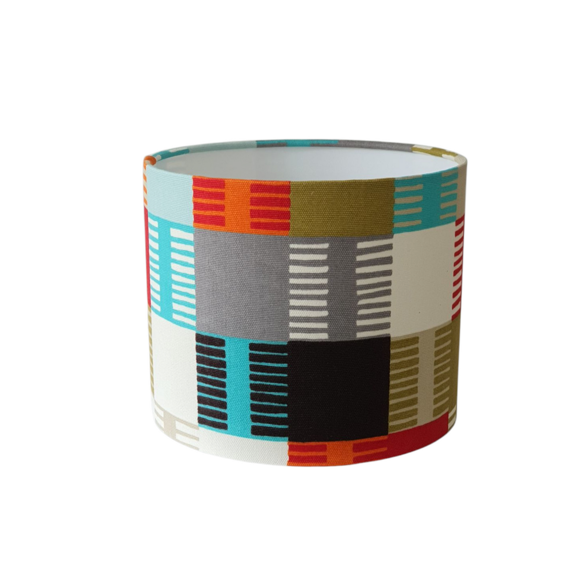Handmade 25cms drum lampshade made with colourful Scion Navajo fabric.