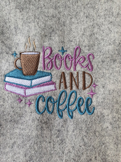 A close up of the machine embroidered pattern on the front of the handmade padded Book Cover.
