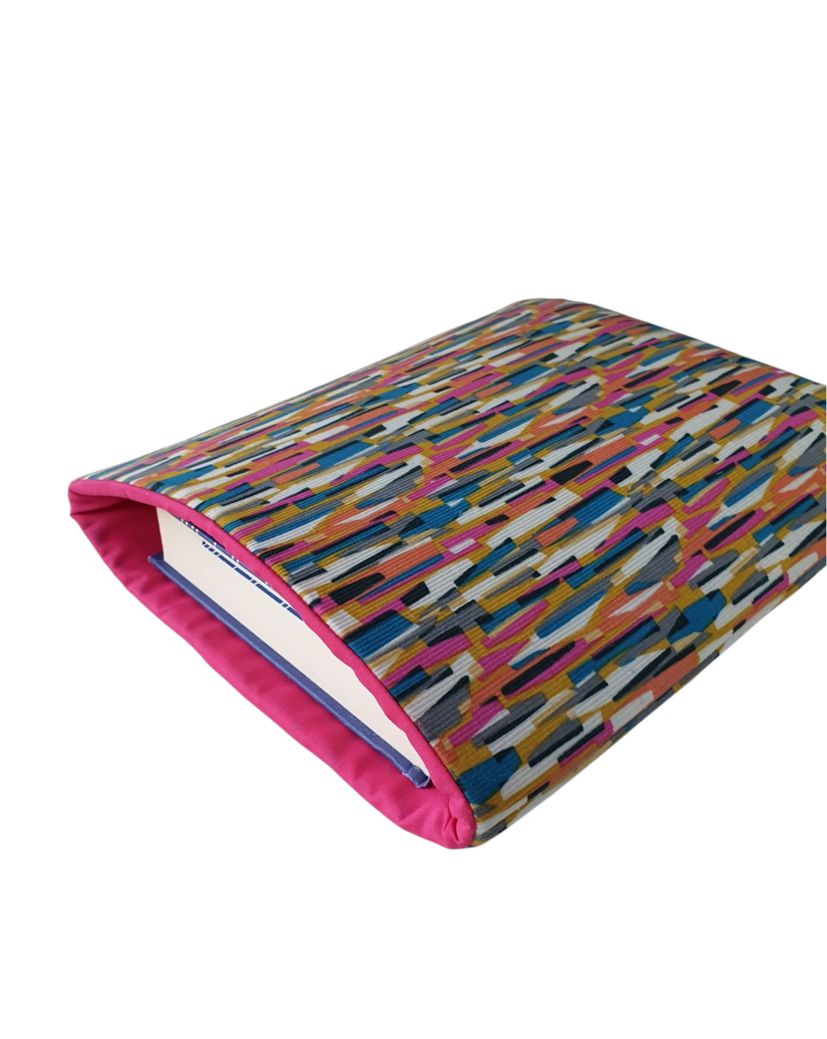 A sideways photo of the handmade padded Book Cover showing a medium hardback book being protected.