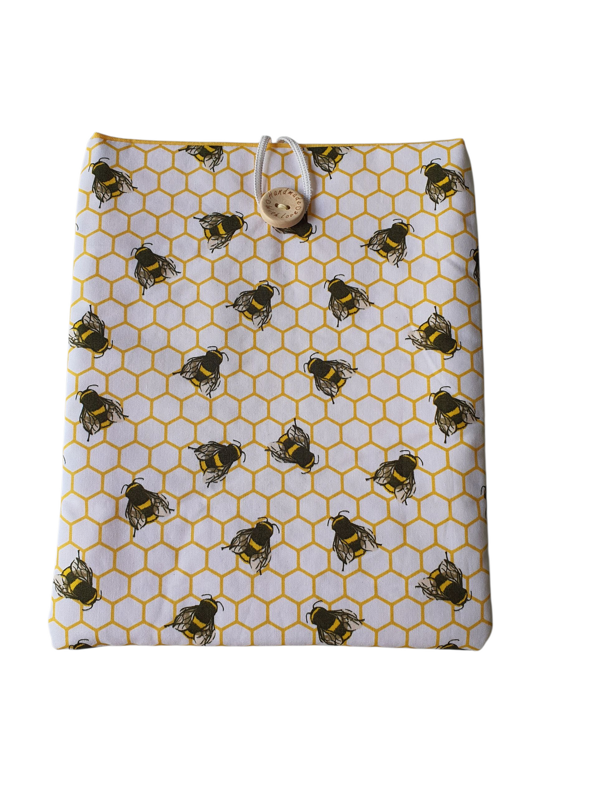 Handmade Book Pouch made with honeycomb bees fabric.  The Book Sleeve is padded with fusible wadding, lined with yellow fabric and fastens with elastic and a button.  This would be an ideal Book Lovers Gift.