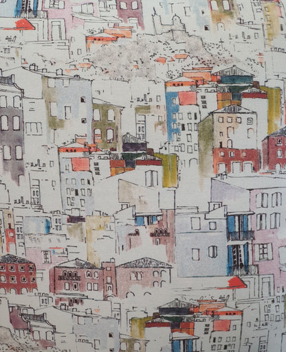 Colourful watercolour style Italian style houses on a light background fabric.  This photo is a close up of the multicolour watercolour style houses, which it is  said is based on houses in Florence.