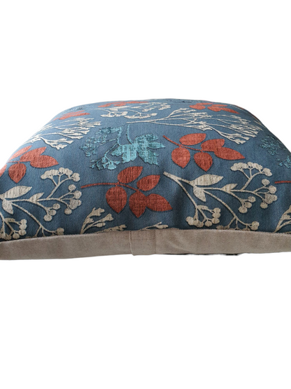 This photo shows the patterned front and the plain neutral fabric on the reverse.  The enclosed zip is halfway down the reverse of the cushion cover, as indicated in the photo.
