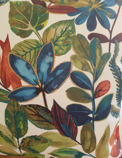Close up of part of the colourful leaf pattern which is on a light background.