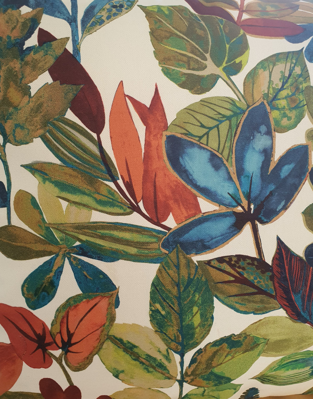 Another close up of the colourful leaf pattern on a light coloured background.