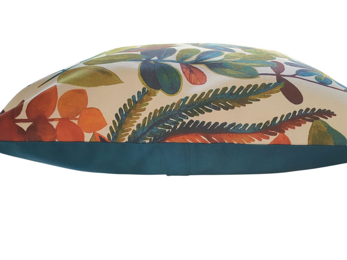 This photo shows the patterned front with the complementing teal fabric on the reverse and the enclosed zip around half way on the cushion cover.  Please note the cushion insert is not included.