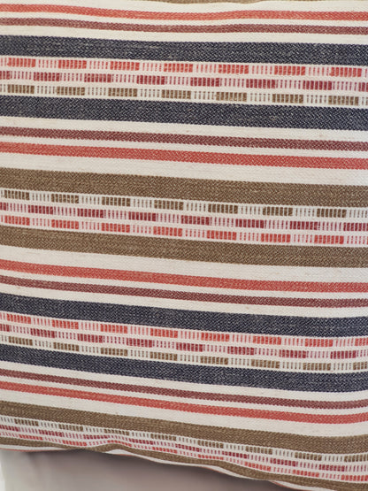 A close up of the multicolour striped fabric used to make the zipped cushion cover.