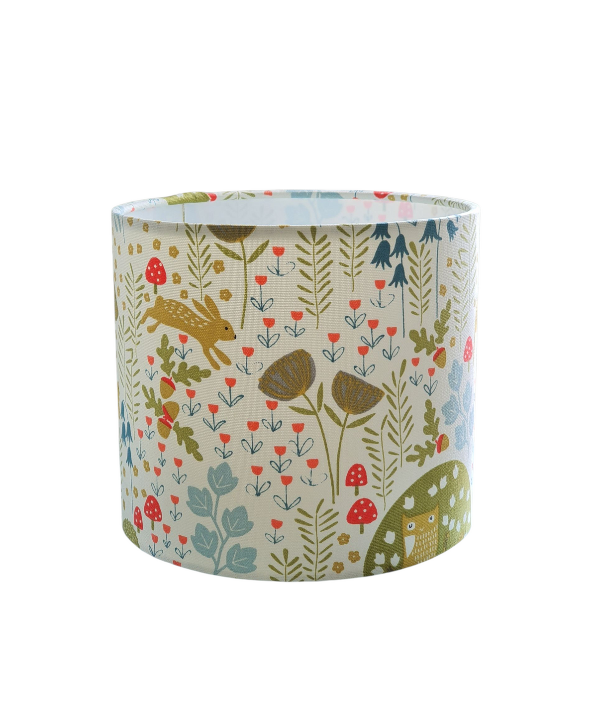 The handmade 20cms drum lampshade is lined with fire retardant white PVC and meets UK Standards and has passed the Lighting Association Glow Wire Test.