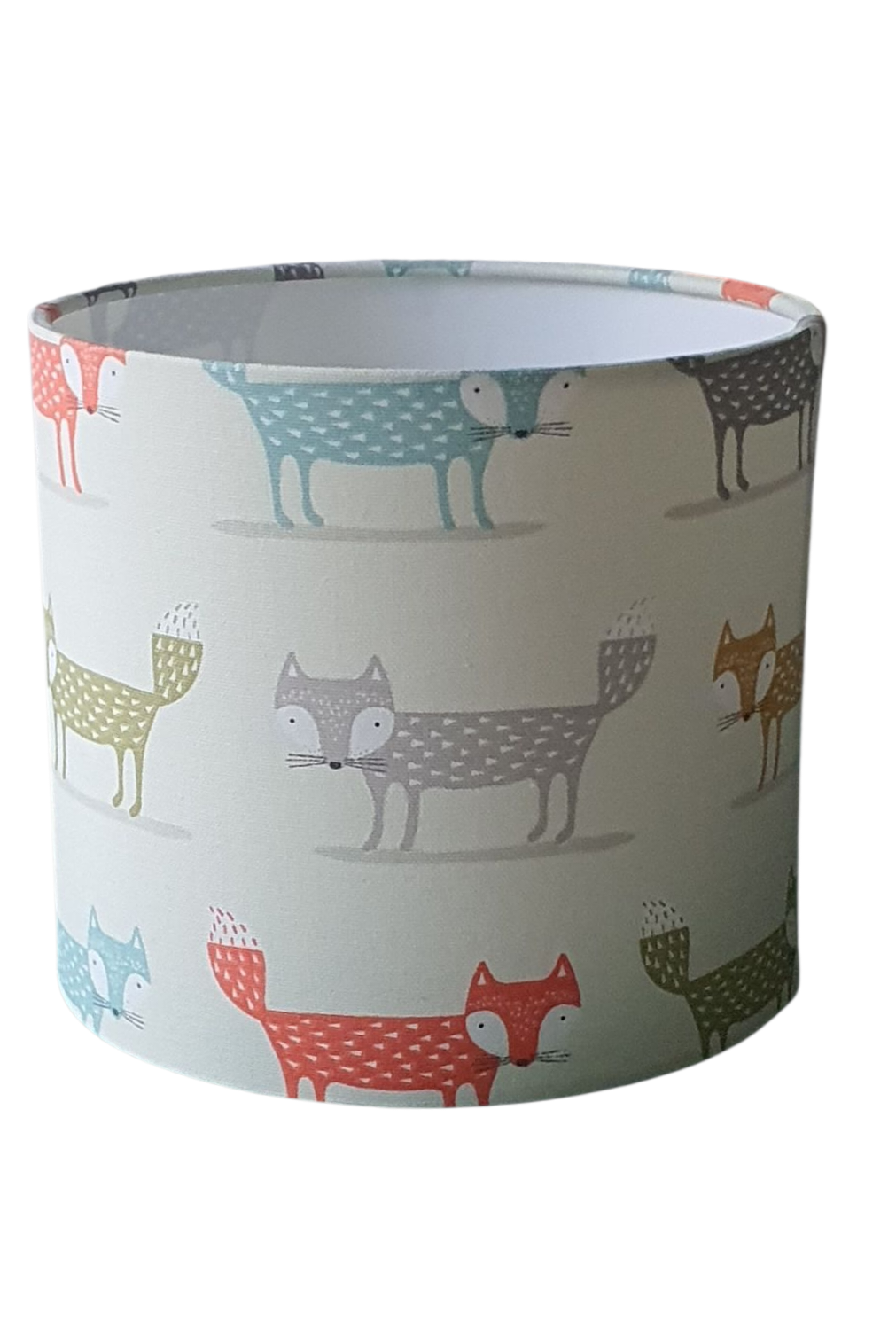 Handmade 20cm drum lampshade made with cute foxes pattern fabric in pastel colours on a neutral background.  The handmade shade is 20cms diameter and 18cms high.  The shade is only suitable for a lamp base due to the pattern direction.
