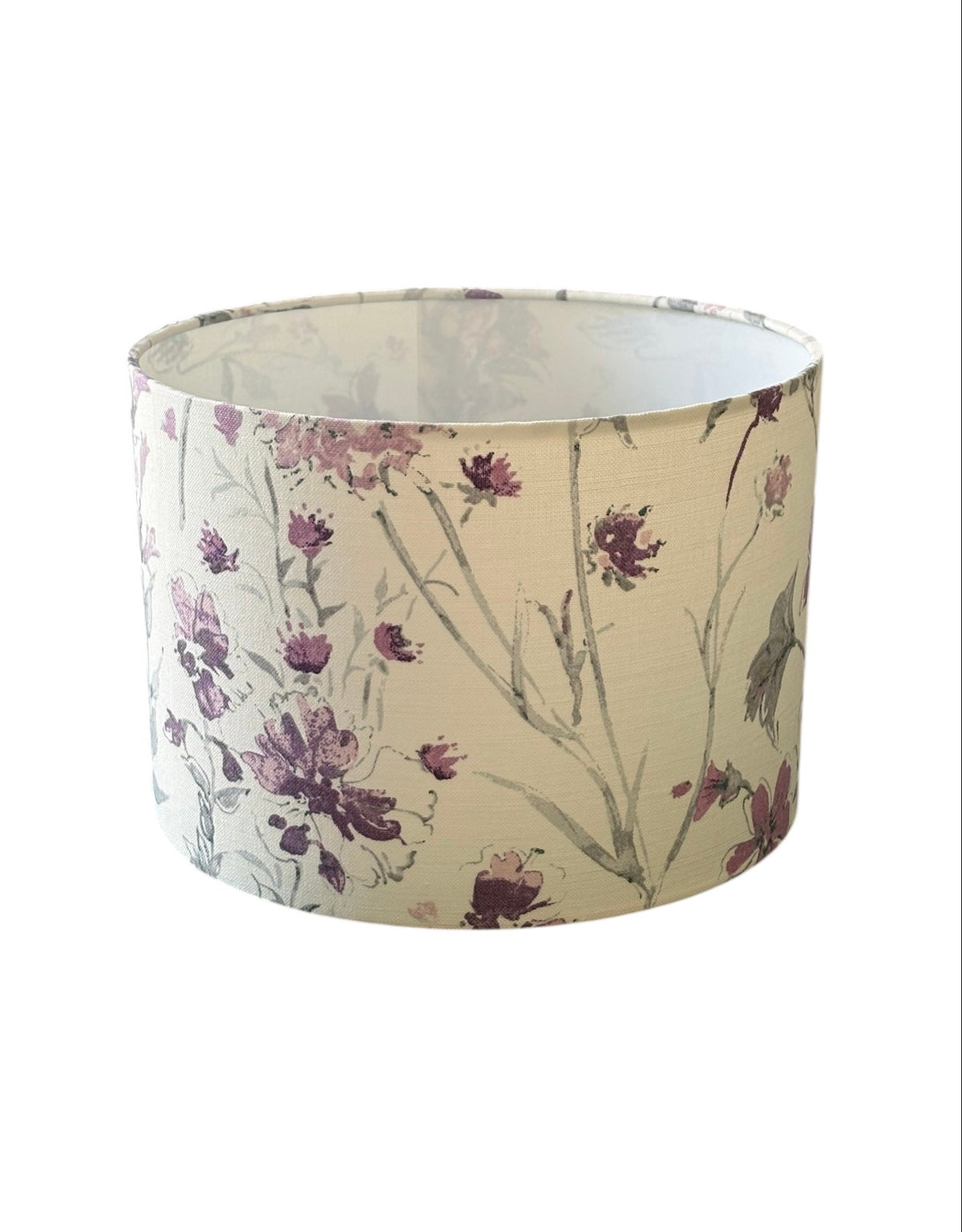 Laura Ashley Wild Meadow drum lampshade with lilac flowers on pale fabric.