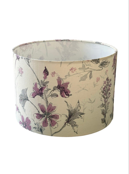 Laura Ashley Wild Meadow drum lampshade view of lilac wildflowers and stems.