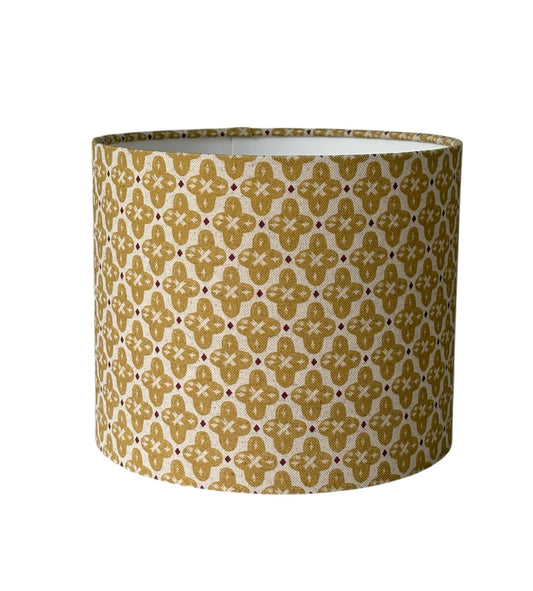 Billy Honey drum lampshade with honey-coloured and cream patterned fabric.