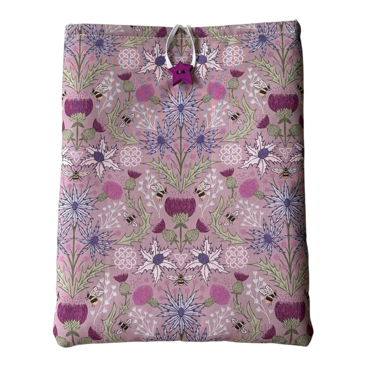 Handmade padded Book Pouch made with pretty Thistle and Bees patterned fabric in shades of purple and lilac.  The padded Book Cover would be an ideal Book Lovers Gift to protect books from wear and tear whilst being carried on the go. 