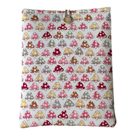 Pastel Toadstool Padded Book Sleeve, showing the fabric pattern