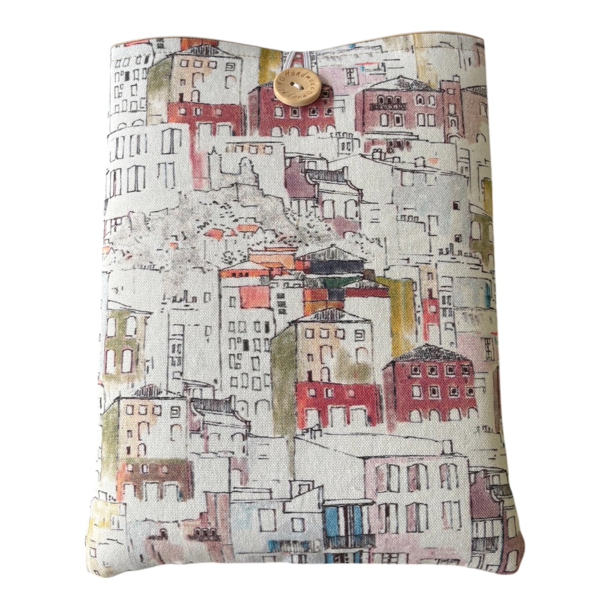The Italian houses themed patterned fabric includes varying styles and colours of houses on a neutral background.