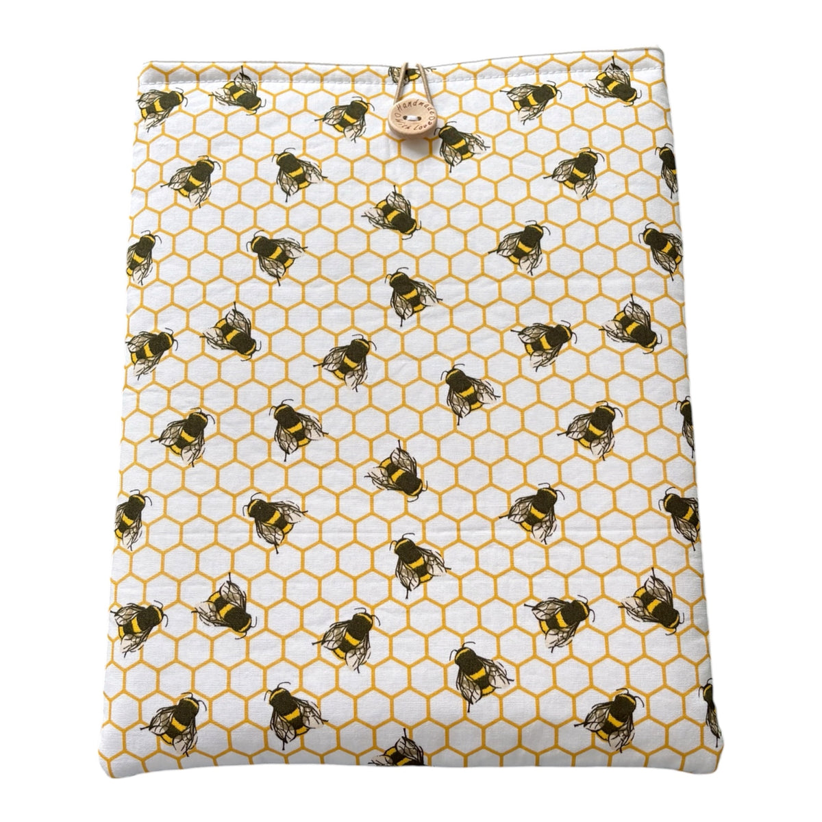 
Honeycomb Bees Padded Book Sleeve, showing the fabric patter.