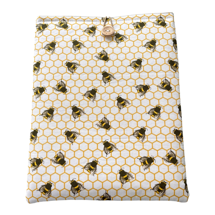Honeycomb Bees Padded Book Sleeve, showing the fabric patter.