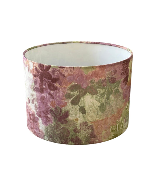 Claude Wisteria Floral drum lampshade with muted pink, green and purple floral fabric.