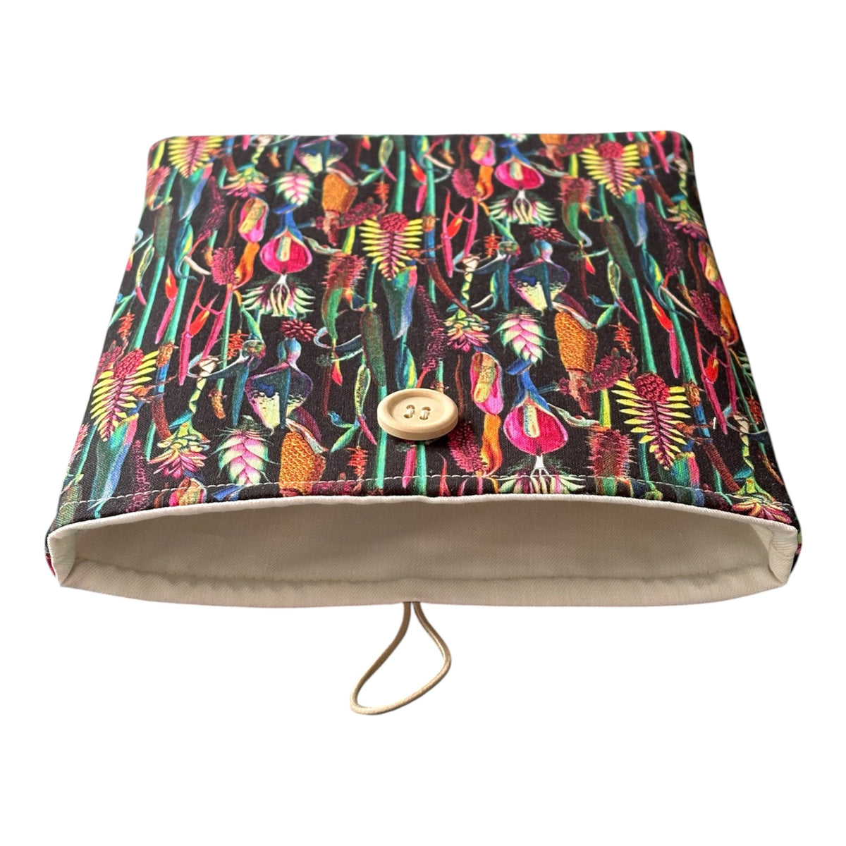 The patterned botanical fabric is complemented with neutral fabric lining as shown in the photo.
