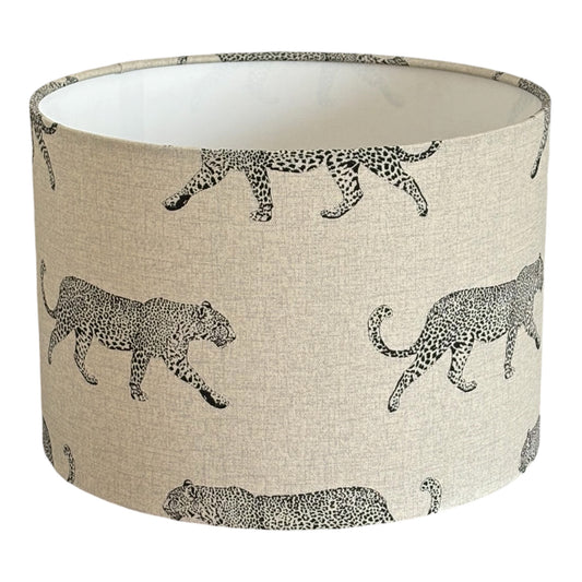 Leopard Print drum lampshade with black leopard silhouettes on neutral fabric.