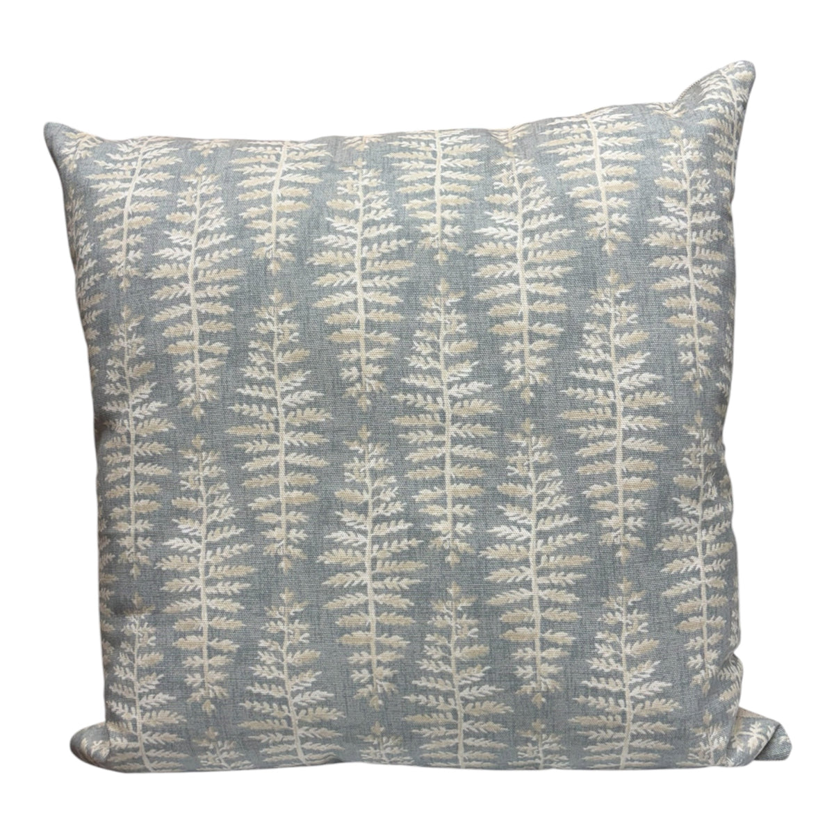 Handmade zipped cushion cover with a neutral coloured fern leaf pattern on a light blue background.  The cushion cover is complemented with neutral fabric on the reverse.