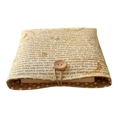 The handmade Book Cover is lined with complementing polka dot fabric.  Please note the book in the photo is not included and is for illustrative purposes only.