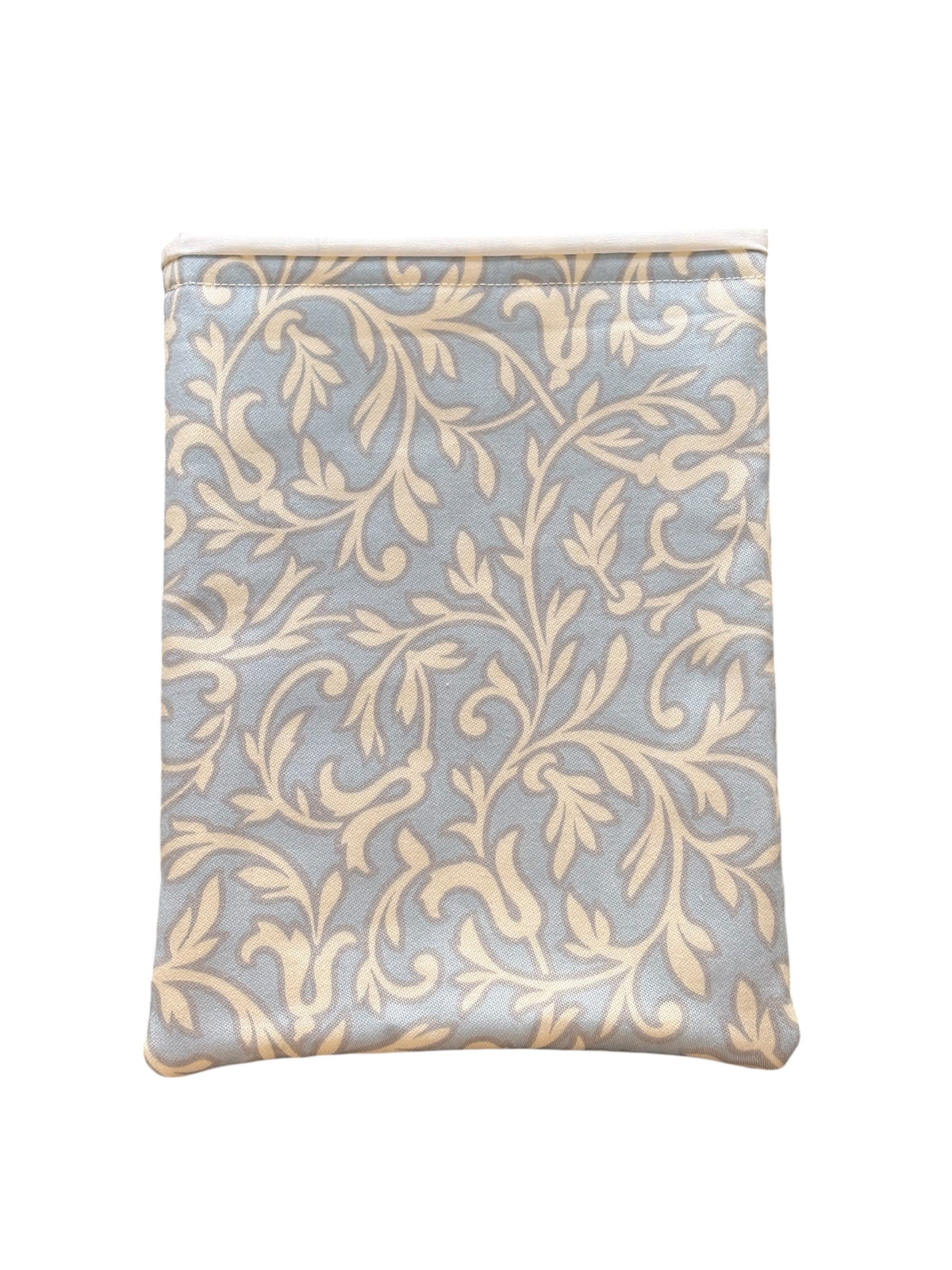 The cream vine leaf style pattern is on a pale blue background, lined with neutral fabric and padded with fusible fleece.  This is an ideal book accessory gift for you or for someone you know who loves reading.