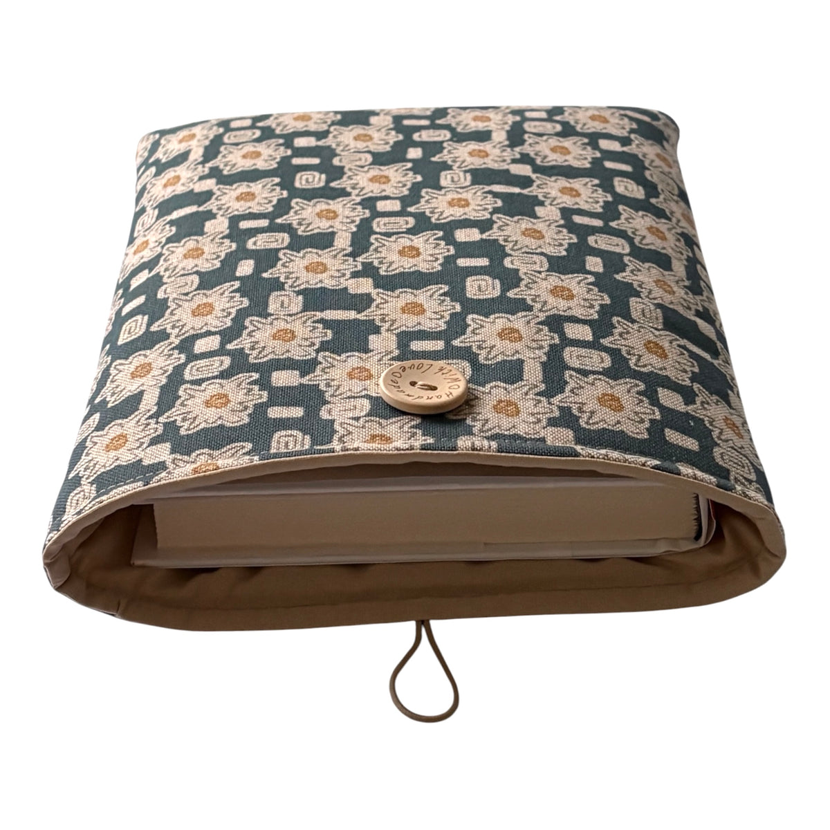 
The padded Pouch fastens with elastic and a button.  Note the book is for illustrative purposes only and is not included.
