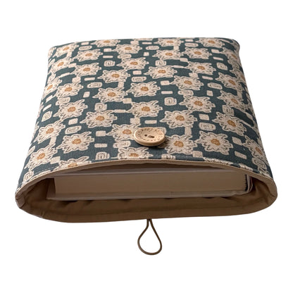 
The padded Pouch fastens with elastic and a button.  Note the book is for illustrative purposes only and is not included.